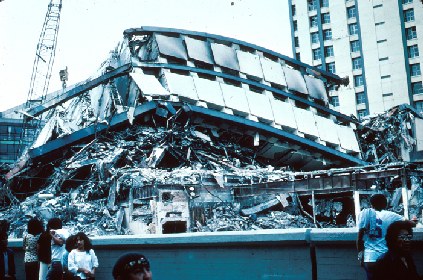 Figure 1: Wreckage of a twenty-one-story, steel-constructed building in the Pina Suarez Apartment Complex. Photo Mehmet Celebi, USGS